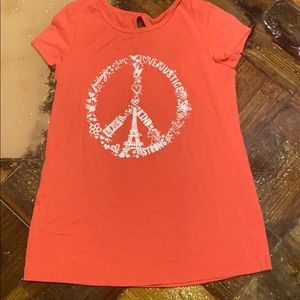 Long length swing style tee. Salmon color